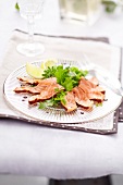Marinated raw salmon with chicory and lettuce