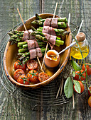 Asparagus and bacon brochettes,roasted cherry tomatoes and soft-boiled egg