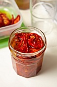 Jar of dried tomatoes in olive oil