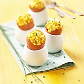 Scrambled eggs with chives served in egg shells