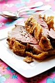 Carved leg of lamb in pastry crust
