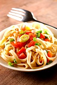 Noodles with red peppers and sesame seeds