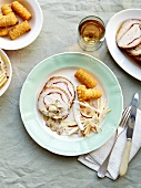 Pork and pancettea roast in creamy mushroom sauce,potato croquettes and chicory-potato salad