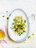 White asparagus with mimosa eggs and parsley