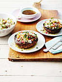 Quinoa,bulghour,mozzarella and pomegranate seed salad served in mushroom tops