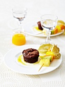 Small chocolate fondante and exotic fruit brochettes
