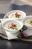 Creamy soup with walnuts and diced bacon