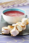 Raspberry-lychee soup and roast marshmallow brochettes