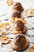 Shortbreads topped with chestnut ice cream, runny chocolate and potato chips