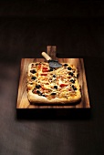 Tomato, black olive and fromage pizza