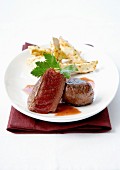 Medium-cooked noisettes fillet of venison and pan-fried slices of celeriac