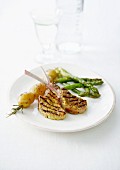 Grilled lamb chops in curry crust, potato rosemary brochette and green asparagus