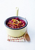 Stewed red cabbage with orange and raw ham