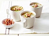 Mugs of chicory soup with brown shrimps