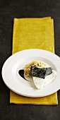 Cod with squid ink and kongnamul
