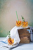 Glasses of peach and thyme Sangria