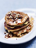 Small oat pancakes with grated apples, hazelnuts, almonds and cinnamon