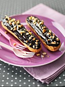 Chocolate Eclairs sprinkled with crushed hazelnuts