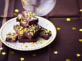 Chocolate ingots topped with crushed pistachios