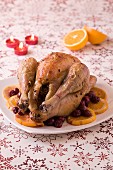 Roasted capon with griotte cherries and oranges