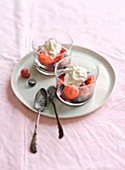 Red berry with cream in glasses