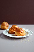 Salted butter toffee cream puffs decorated with golden flakes