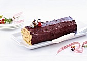 Buche de Noel (French Christmas cake) with chestnuts and dark chocolate glaze