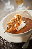 Dublin Bay prawn bisque,whipped cream quenelle and aniseed-flavored gambas brochettes