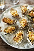 Oysters grilled with diced apples,shallots and curry