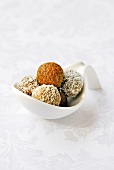 Linseed and turmeric truffles coated in coconut,almond and bergamot