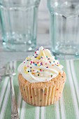 Cupcake sprinkled with multicolored sugar droplets