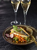 Roasted sea bream on a bed of diced vegetables in reduced Champagne sauce