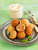 Minty sweet potato croquettes, harissa-flavored mayonnaise