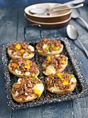 Baked potato stuffed with ground meat,peppers and cheese