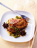 Spicy caramelized chicken with peas