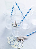 Plastic cups, striped straws and name tags
