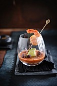 Tomato gaspacho with flambeed scampi