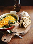 Spinach gratin with Cheddar cheese served as a dip