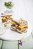 Smoked chicken sandwich with mango and avocado