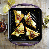 Brie,rhubarb jam and crushed pistachio toasts