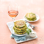 Herb cakes with garlic cream and a glass of Bordeaux Rosé