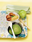 Child's meal on a tray : pea soup,meatballs,bulghour and a green apple