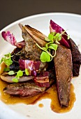 Duck leg with onions and red chicory