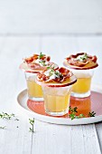 Apple,fried bacon and thyme cream bites,glasses of hot apple juice
