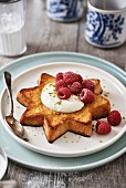 Star-shaped Pandoro toast with cream and raspberries