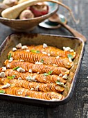 Sweet baked potatoes with feta and mint