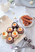 Chocolate eggs with cream filling and pastry strips for dipping
