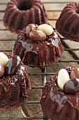 Small chocolate crown cakes garnished with Easter eggs