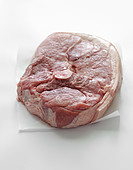 Raw round pork steak