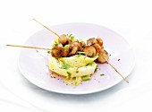 Petoncle scallop brochettes and blanched white cabbage leaves